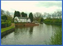 One of the cottages with a Barrel Roof found along this stretch of the Stratford on Avon Canal .